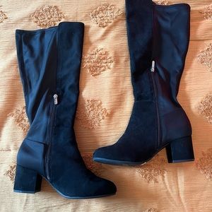 Never worn Black suede, wide calf, knee boots from Torrid. Never worn
